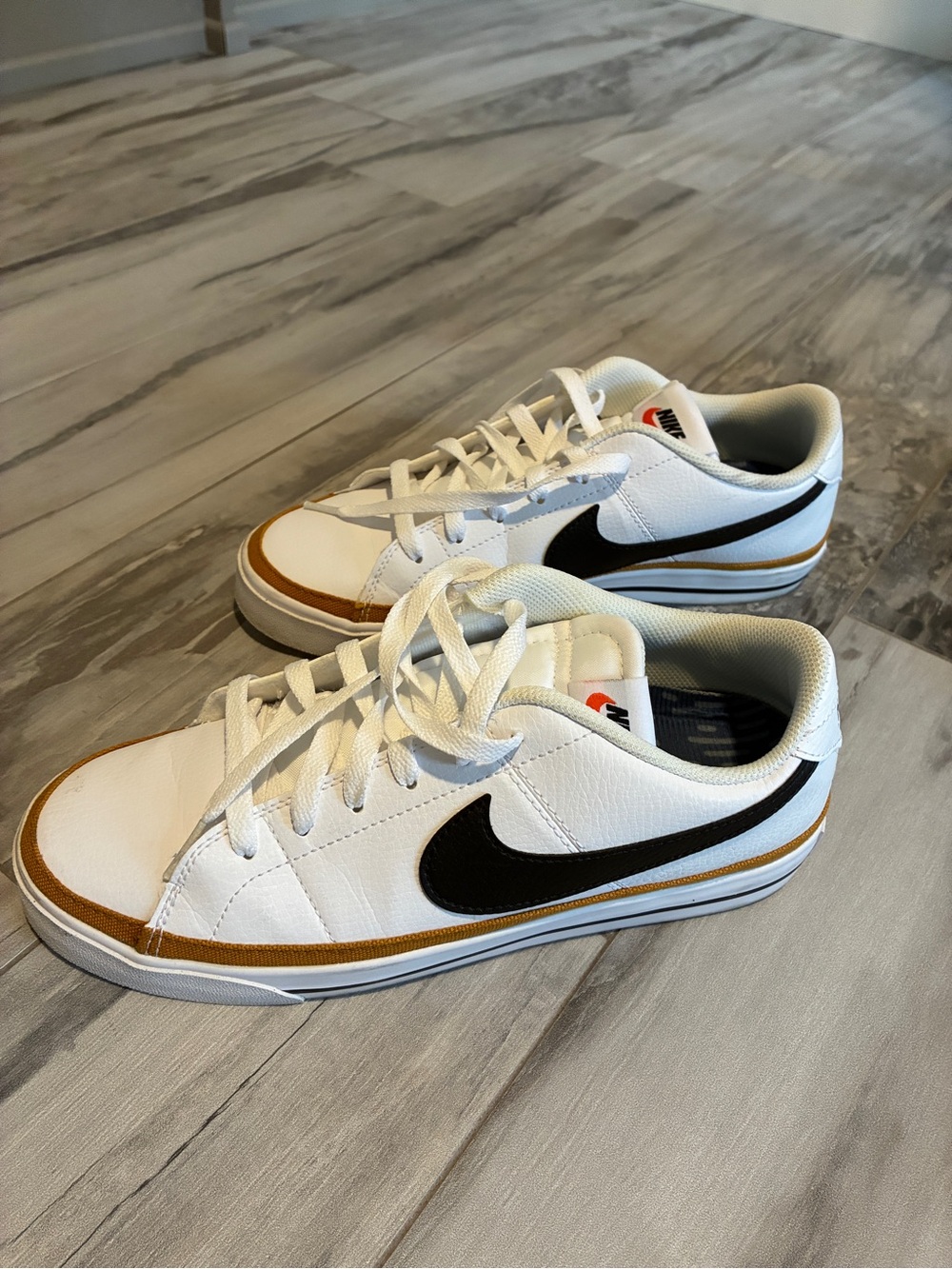 Nike White Sneakers with Black Swoosh and Tan Trim